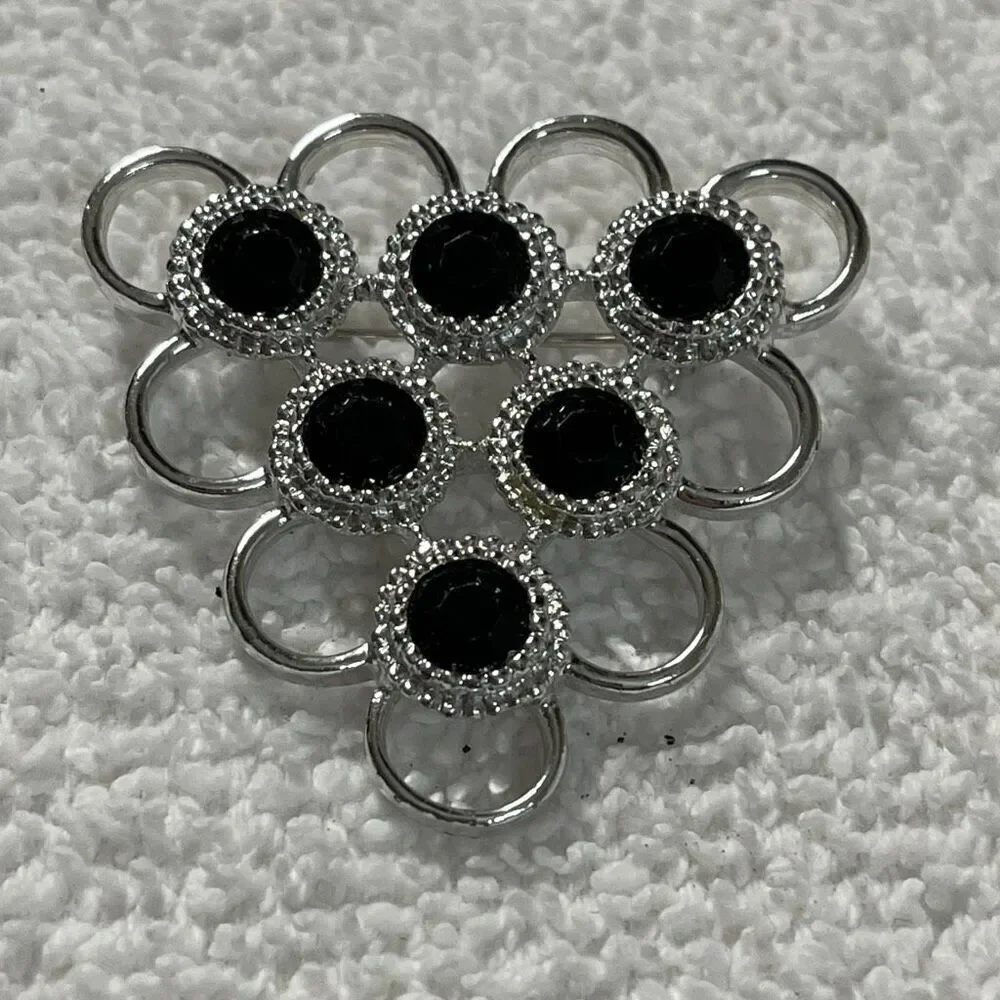 Vintage Sarah Coventry triangle open design black glass brooch